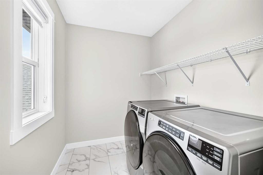 137 Creekside Way Sw, Calgary, AB - Indoor Photo Showing Laundry Room