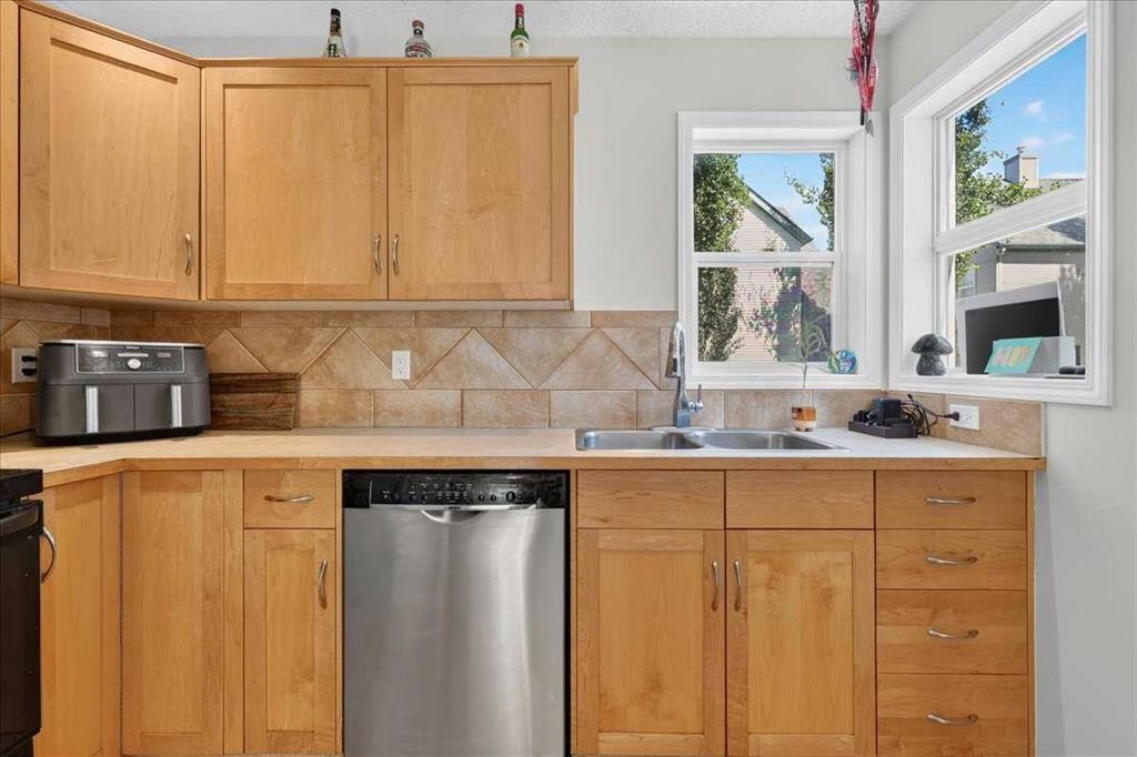 137 Bridlewood Lane Sw, Calgary, AB - Indoor Photo Showing Kitchen With Double Sink