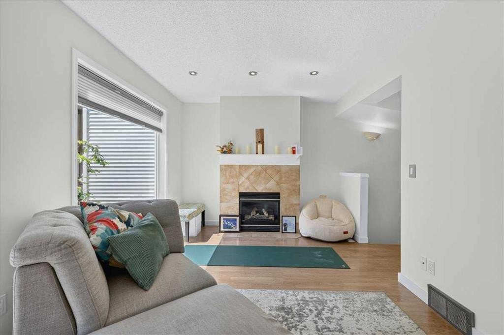 137 Bridlewood Lane Sw, Calgary, AB - Indoor Photo Showing Living Room With Fireplace