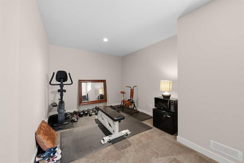 464 Quarry Villas Se, Calgary, AB - Indoor Photo Showing Gym Room