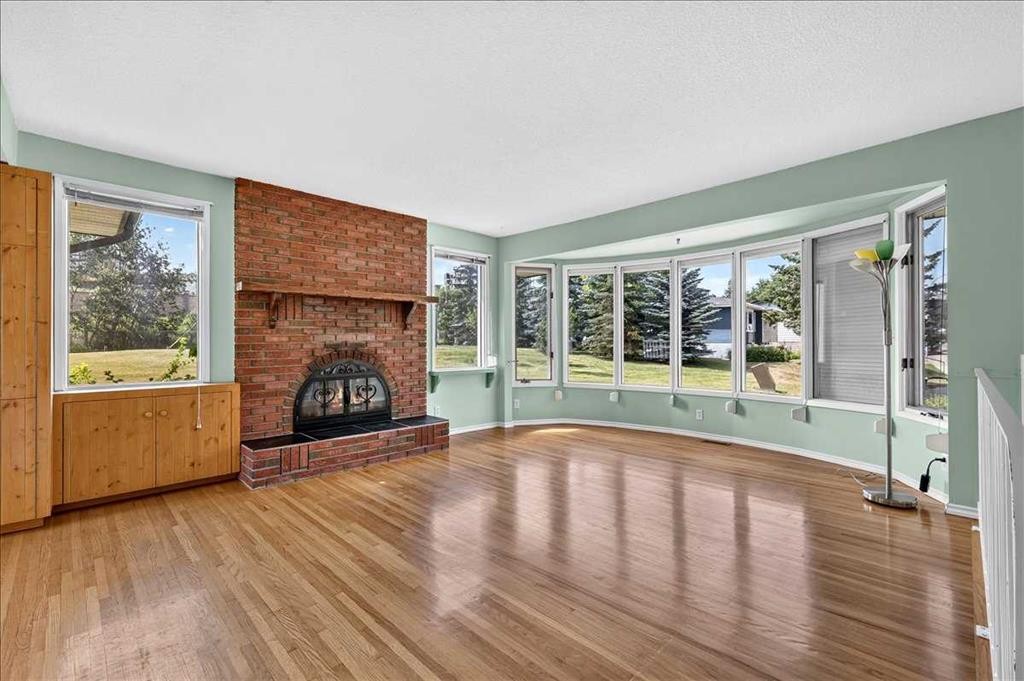 7727 Bowcliffe Crescent Nw, Calgary, AB - Indoor Photo Showing Other Room With Fireplace