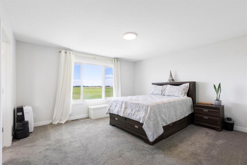183 Brander Avenue, Langdon, AB - Indoor Photo Showing Bedroom