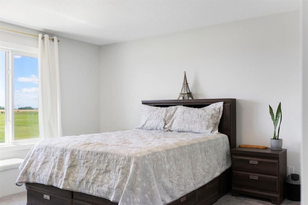 183 Brander Avenue, Langdon, AB - Indoor Photo Showing Bedroom