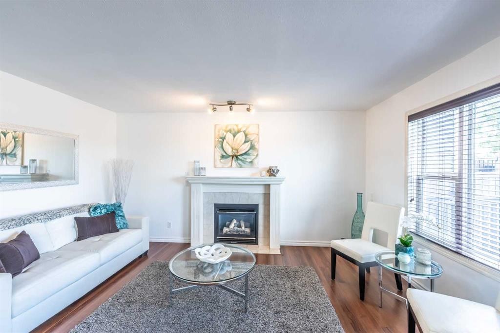 203 Coville Close Ne, Calgary, AB - Indoor Photo Showing Living Room With Fireplace