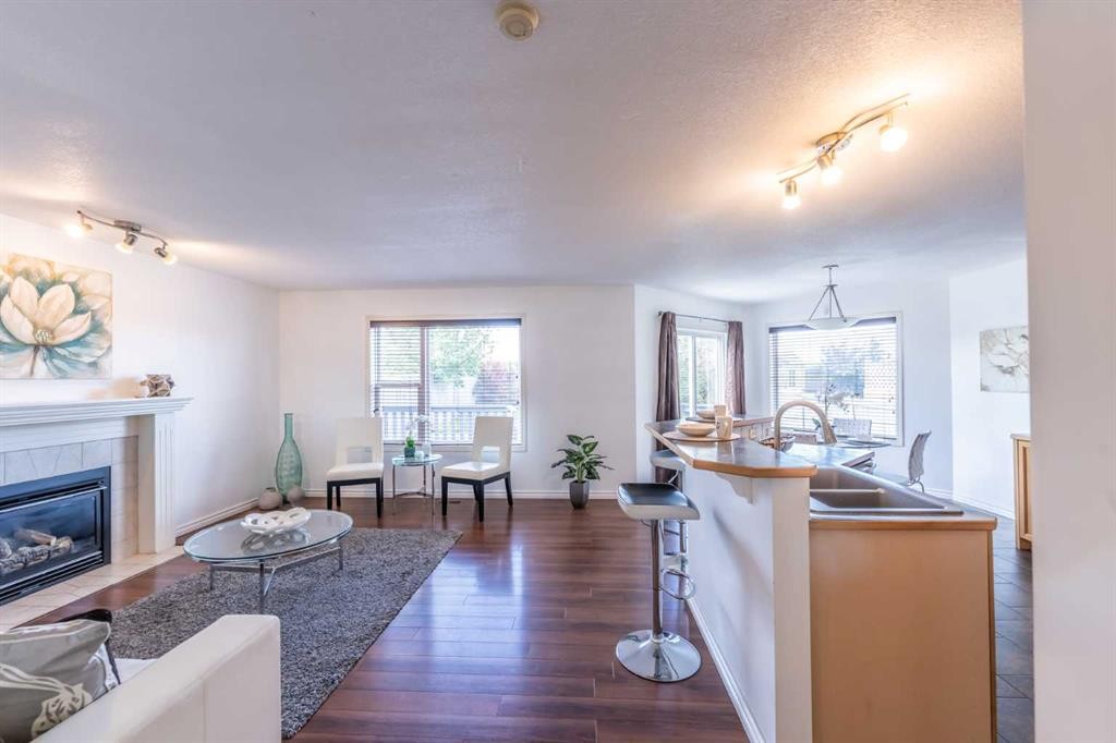 203 Coville Close Ne, Calgary, AB - Indoor Photo Showing Living Room With Fireplace