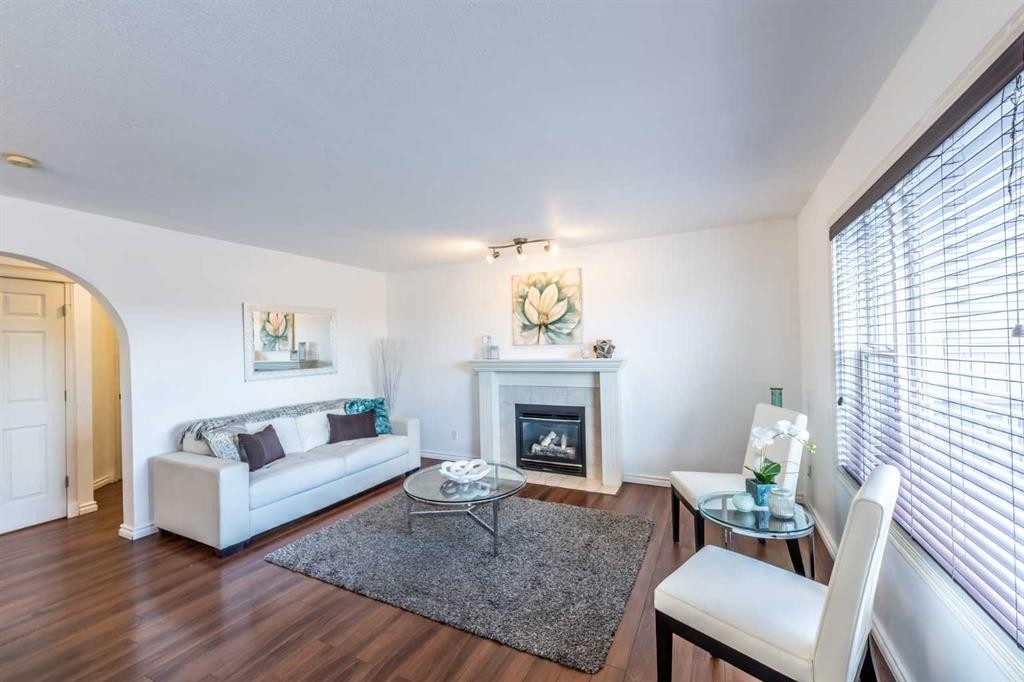 203 Coville Close Ne, Calgary, AB - Indoor Photo Showing Living Room With Fireplace