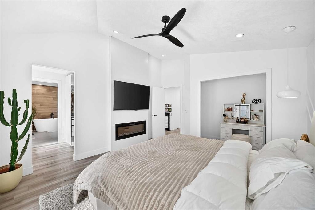 10909 Hidden Valley Drive Nw, Calgary, AB - Indoor Photo Showing Bedroom With Fireplace