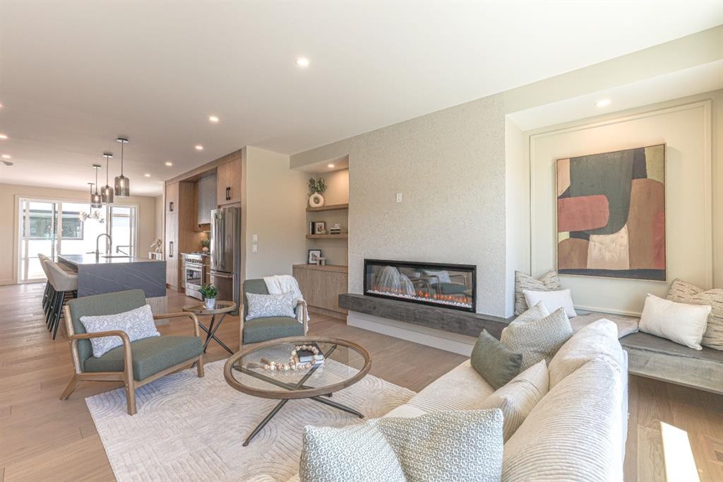 147 Heston Street Nw, Calgary, AB - Indoor Photo Showing Living Room With Fireplace