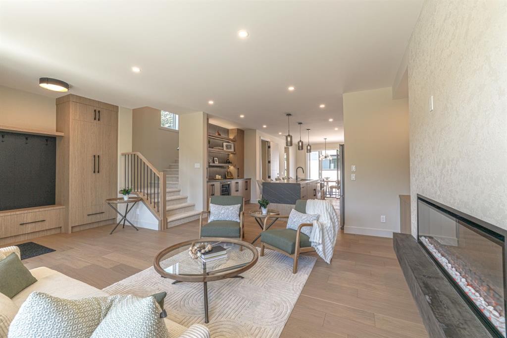 147 Heston Street Nw, Calgary, AB - Indoor Photo Showing Living Room With Fireplace