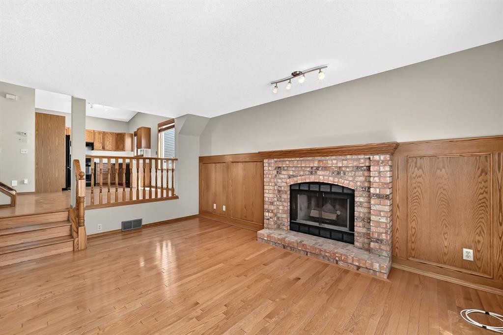 192 Riverbend Drive Se, Calgary, AB - Indoor Photo Showing Living Room With Fireplace