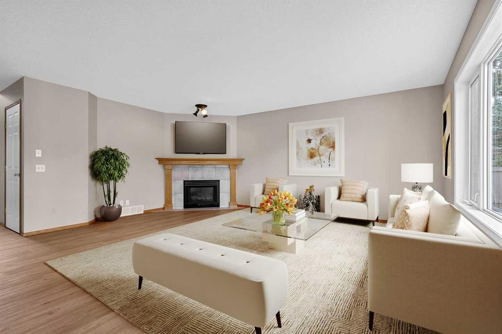 249 Scotia Point Nw, Calgary, AB - Indoor Photo Showing Living Room With Fireplace