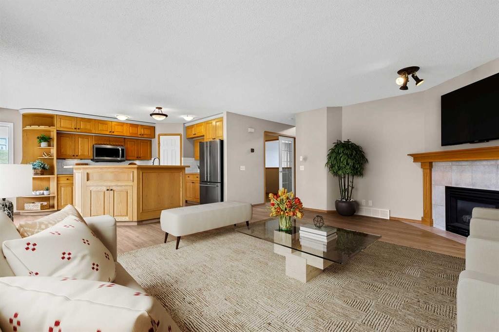 249 Scotia Point Nw, Calgary, AB - Indoor Photo Showing Living Room With Fireplace