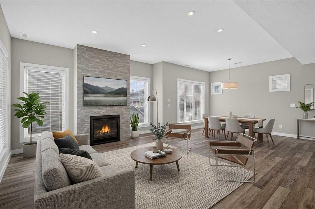 4-2416 30 Street Sw, Calgary, AB - Indoor Photo Showing Living Room With Fireplace