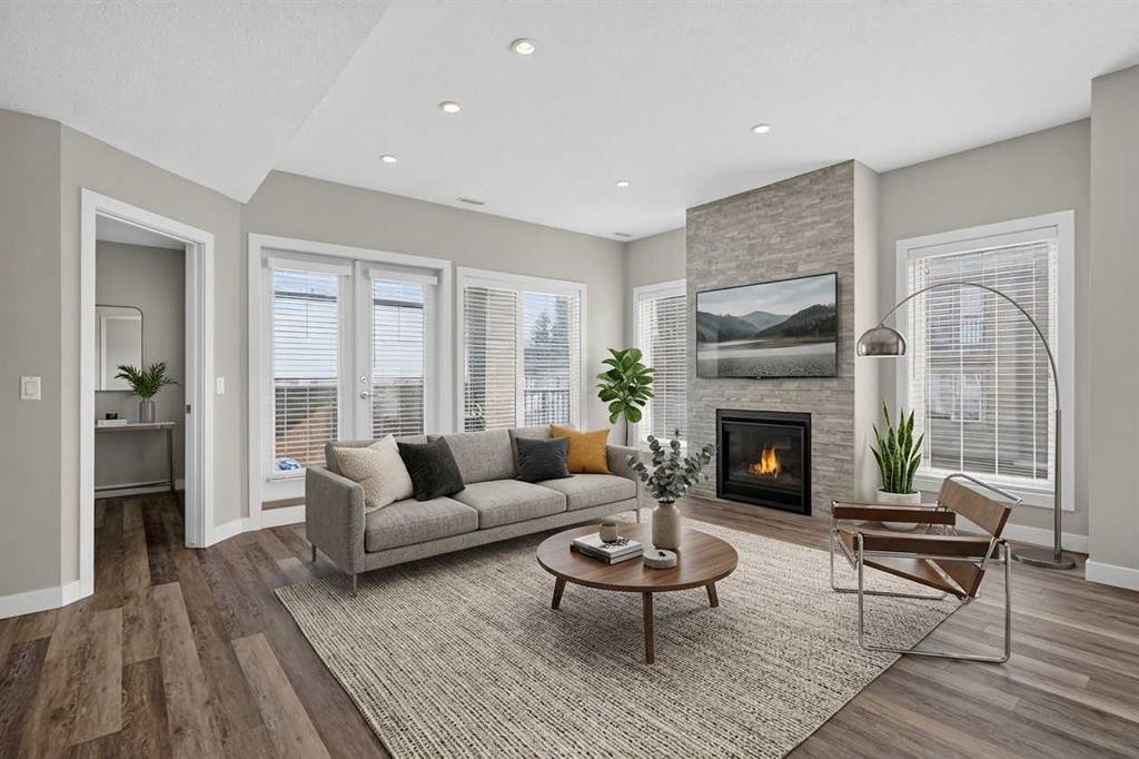 4-2416 30 Street Sw, Calgary, AB - Indoor Photo Showing Living Room With Fireplace