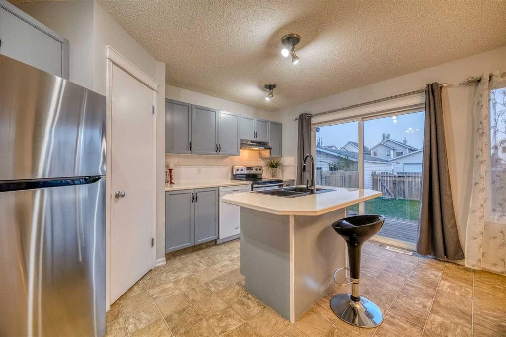 81 Prestwick Avenue Se, Calgary, AB - Indoor Photo Showing Kitchen With Double Sink