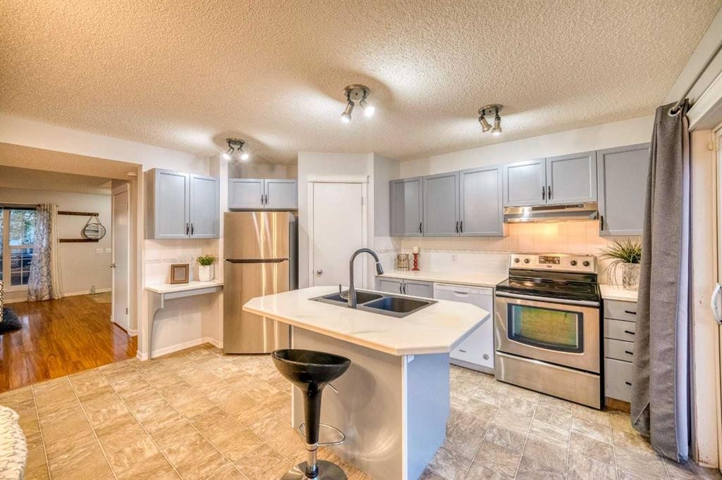 81 Prestwick Avenue Se, Calgary, AB - Indoor Photo Showing Kitchen With Double Sink