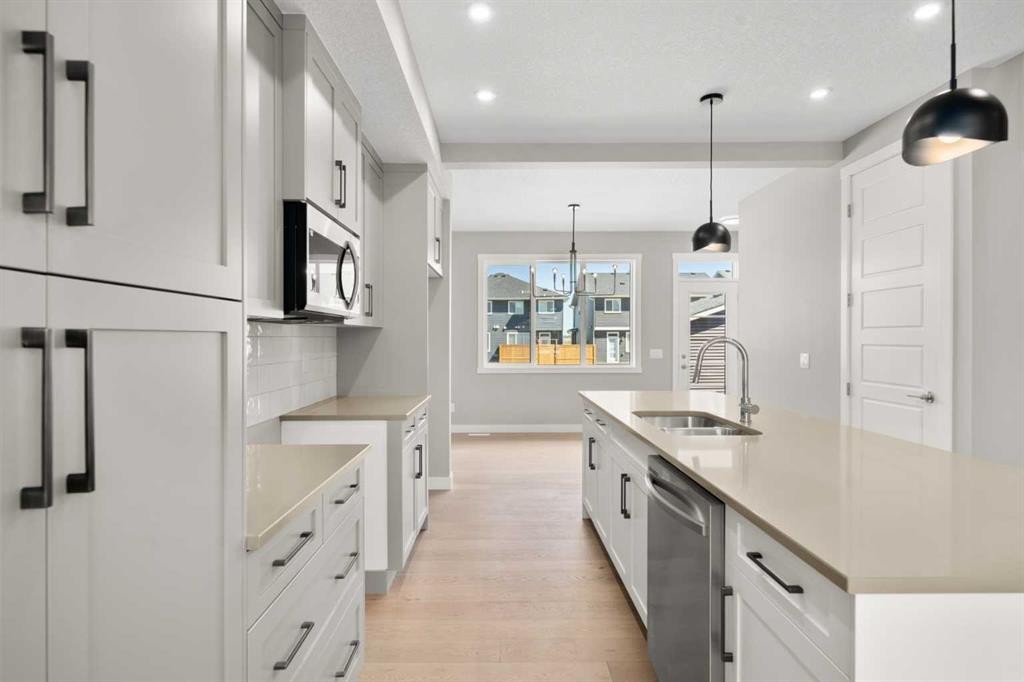 78 Sora Gardens Se, Calgary, AB - Indoor Photo Showing Kitchen With Double Sink With Upgraded Kitchen