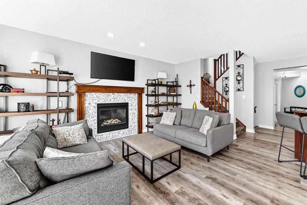 144 Pantego Close Nw, Calgary, AB - Indoor Photo Showing Living Room With Fireplace