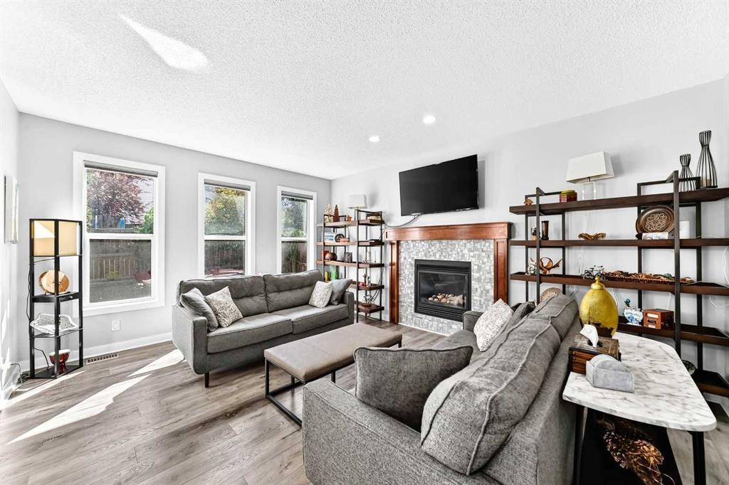 144 Pantego Close Nw, Calgary, AB - Indoor Photo Showing Living Room With Fireplace
