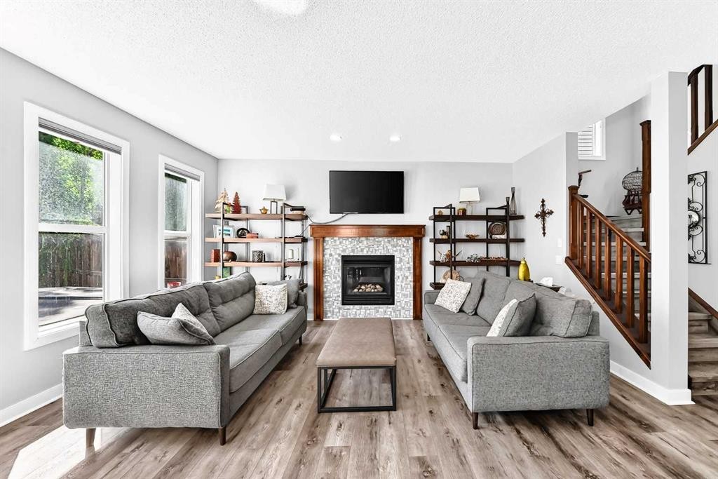 144 Pantego Close Nw, Calgary, AB - Indoor Photo Showing Living Room With Fireplace