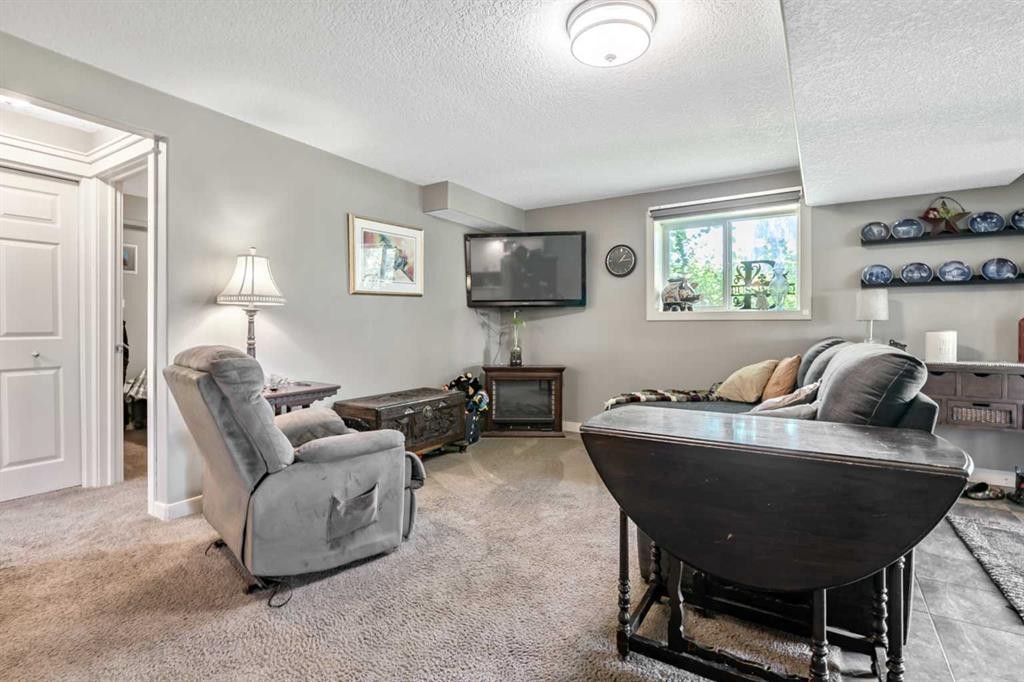 13 Dain Place Nw, Langdon, AB - Indoor Photo Showing Other Room