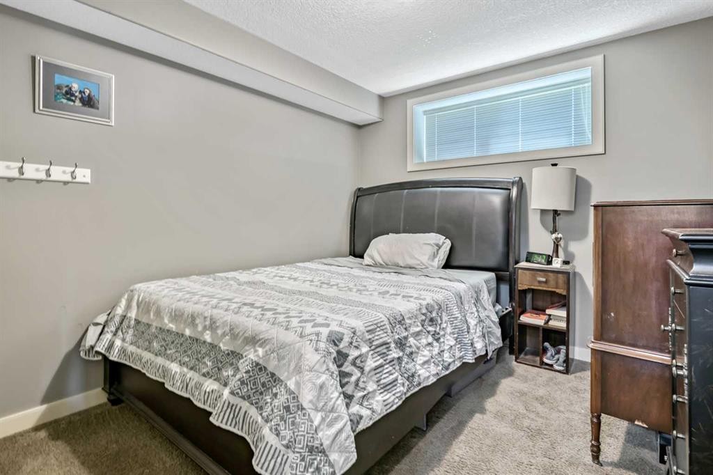 13 Dain Place Nw, Langdon, AB - Indoor Photo Showing Bedroom