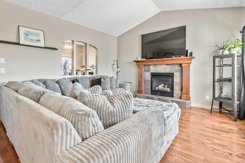 13 Dain Place Nw, Langdon, AB - Indoor Photo Showing Living Room With Fireplace
