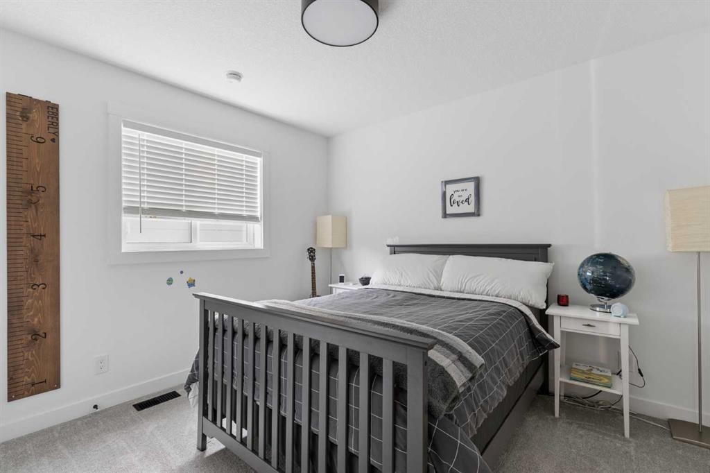 203 Cranbrook Park Se, Calgary, AB - Indoor Photo Showing Bedroom
