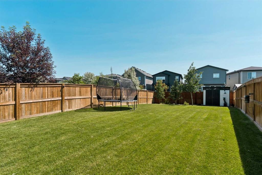 203 Cranbrook Park Se, Calgary, AB - Outdoor With Backyard