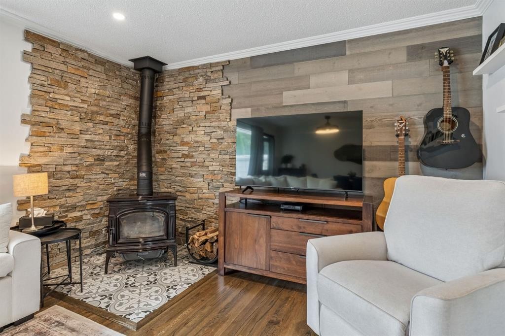 27 Heston Street Nw, Calgary, AB - Indoor Photo Showing Living Room With Fireplace