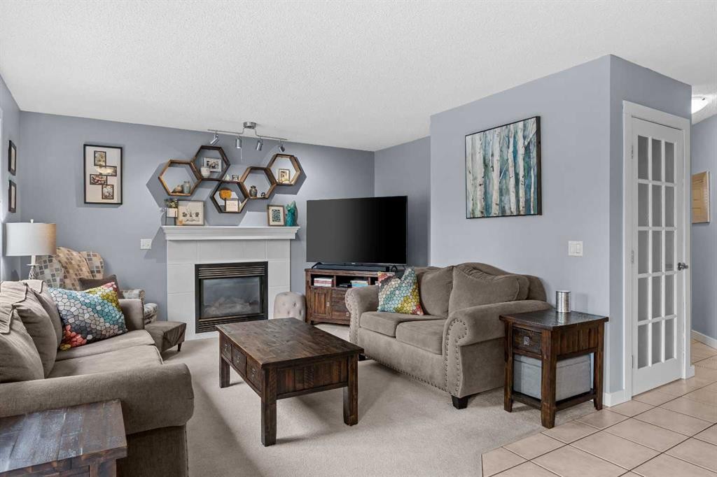 109 Hidden Valley Grove Nw, Calgary, AB - Indoor Photo Showing Living Room With Fireplace