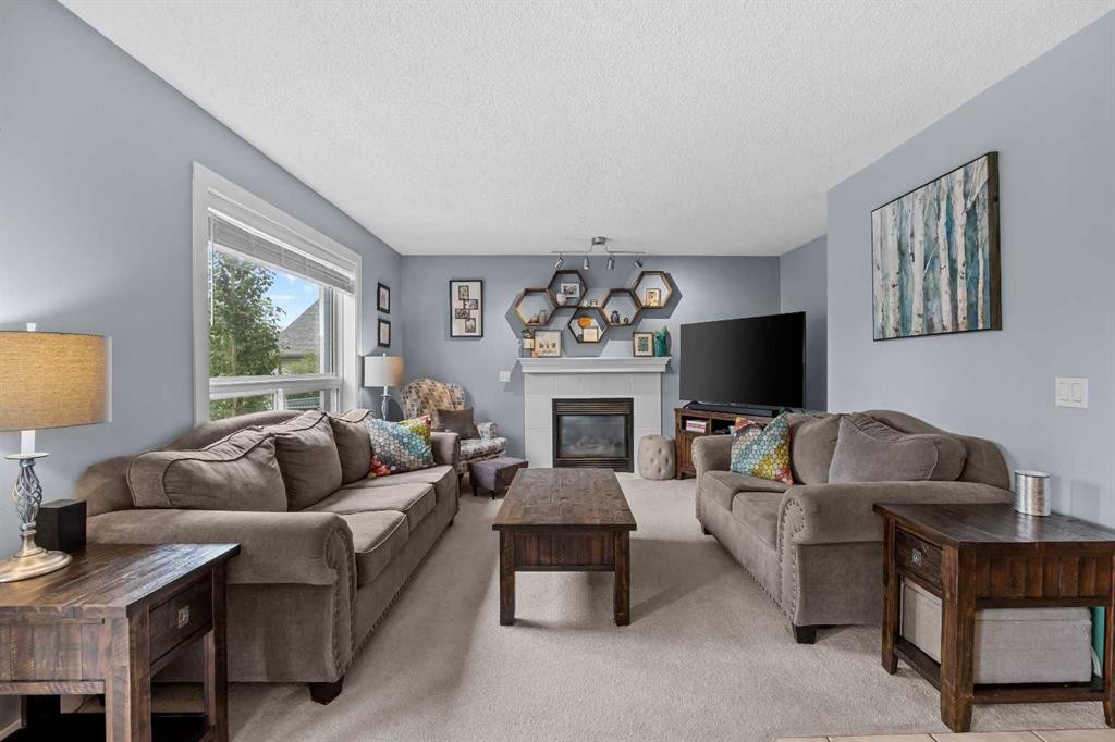 109 Hidden Valley Grove Nw, Calgary, AB - Indoor Photo Showing Living Room With Fireplace
