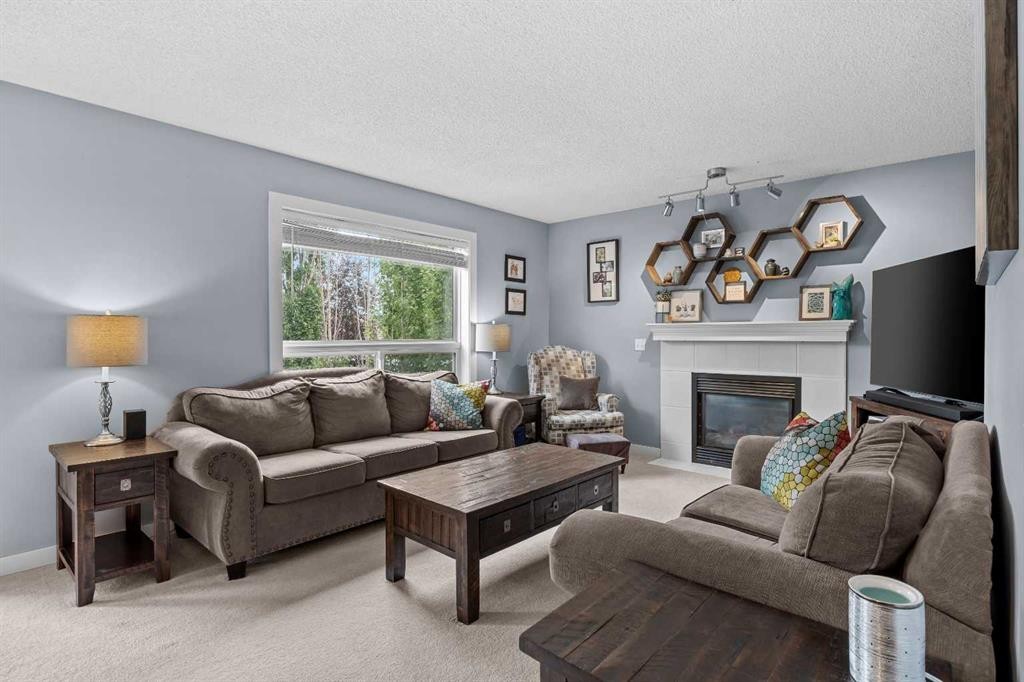 109 Hidden Valley Grove Nw, Calgary, AB - Indoor Photo Showing Living Room With Fireplace