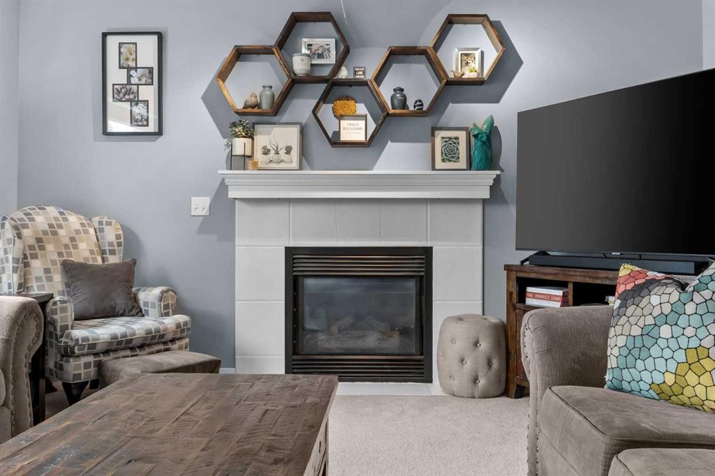 109 Hidden Valley Grove Nw, Calgary, AB - Indoor Photo Showing Living Room With Fireplace