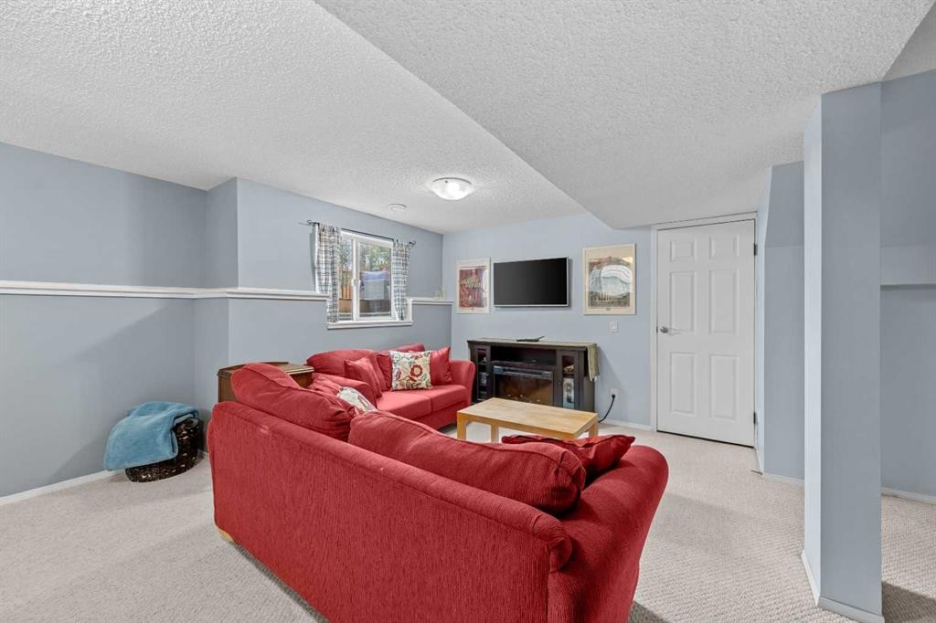 109 Hidden Valley Grove Nw, Calgary, AB - Indoor With Fireplace