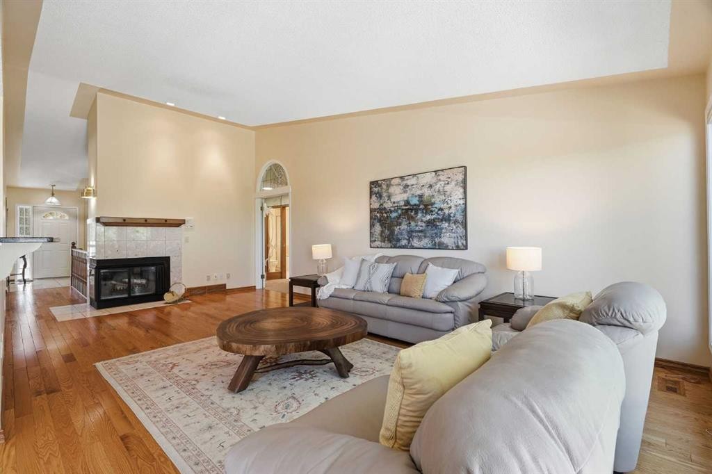 135 Shawnee Rise Sw, Calgary, AB - Indoor Photo Showing Living Room With Fireplace