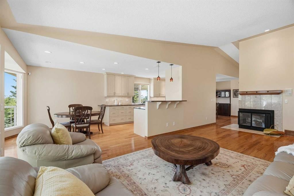 135 Shawnee Rise Sw, Calgary, AB - Indoor Photo Showing Living Room With Fireplace