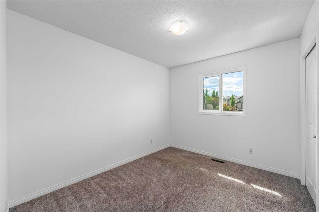 15 Panora Square Nw, Calgary, AB - Indoor Photo Showing Other Room