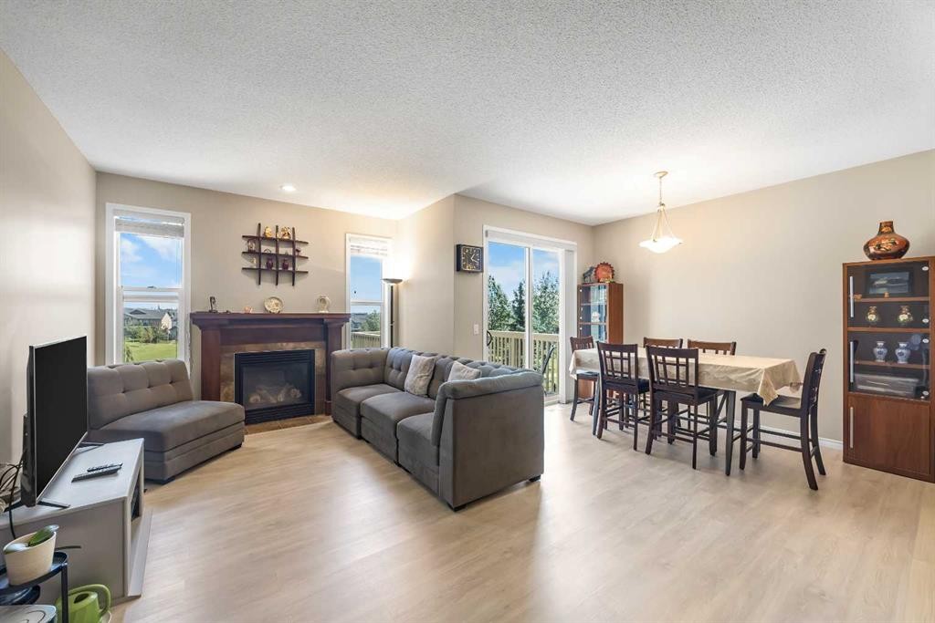 32 Panatella Common Nw, Calgary, AB - Indoor Photo Showing Living Room With Fireplace