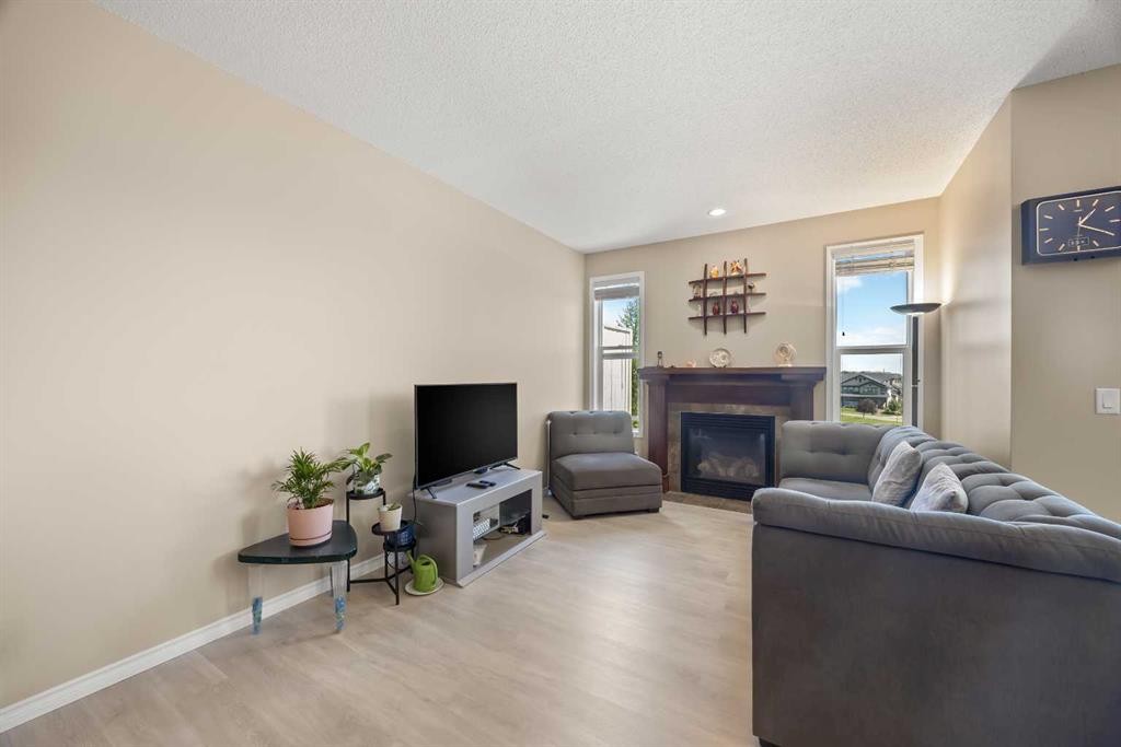 32 Panatella Common Nw, Calgary, AB - Indoor Photo Showing Living Room With Fireplace