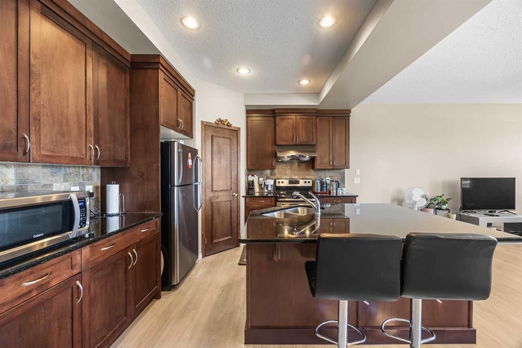 32 Panatella Common Nw, Calgary, AB - Indoor Photo Showing Kitchen With Stainless Steel Kitchen