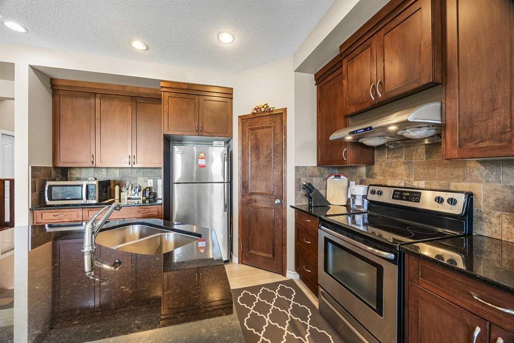 32 Panatella Common Nw, Calgary, AB - Indoor Photo Showing Kitchen With Stainless Steel Kitchen With Double Sink
