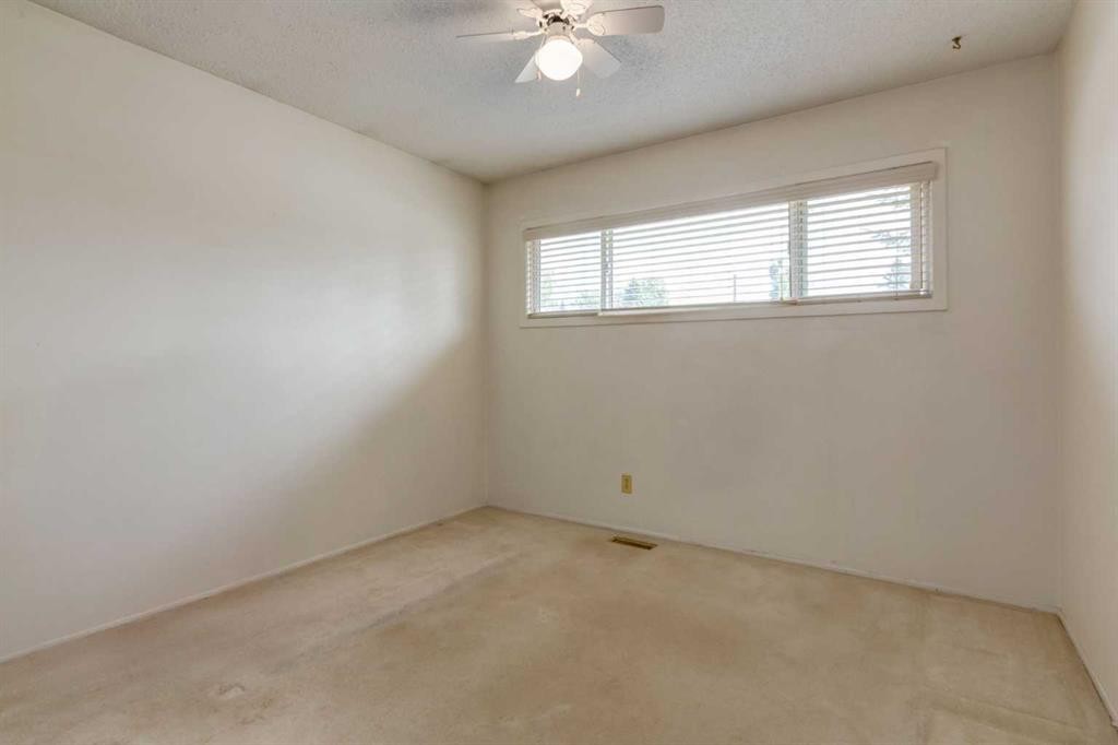 228 Maple Court Crescent Se, Calgary, AB - Indoor Photo Showing Other Room
