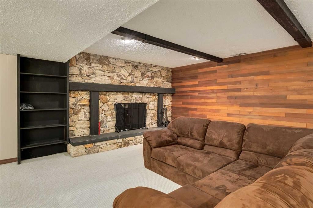 228 Maple Court Crescent Se, Calgary, AB - Indoor Photo Showing Living Room With Fireplace