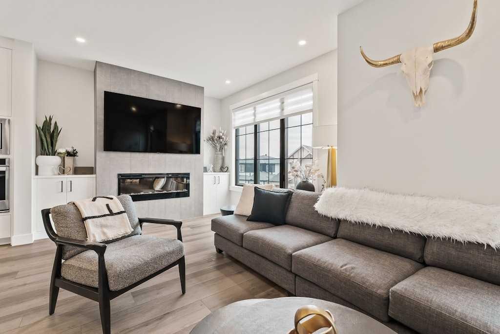 138 Discovery Drive Sw, Calgary, AB - Indoor Photo Showing Living Room With Fireplace