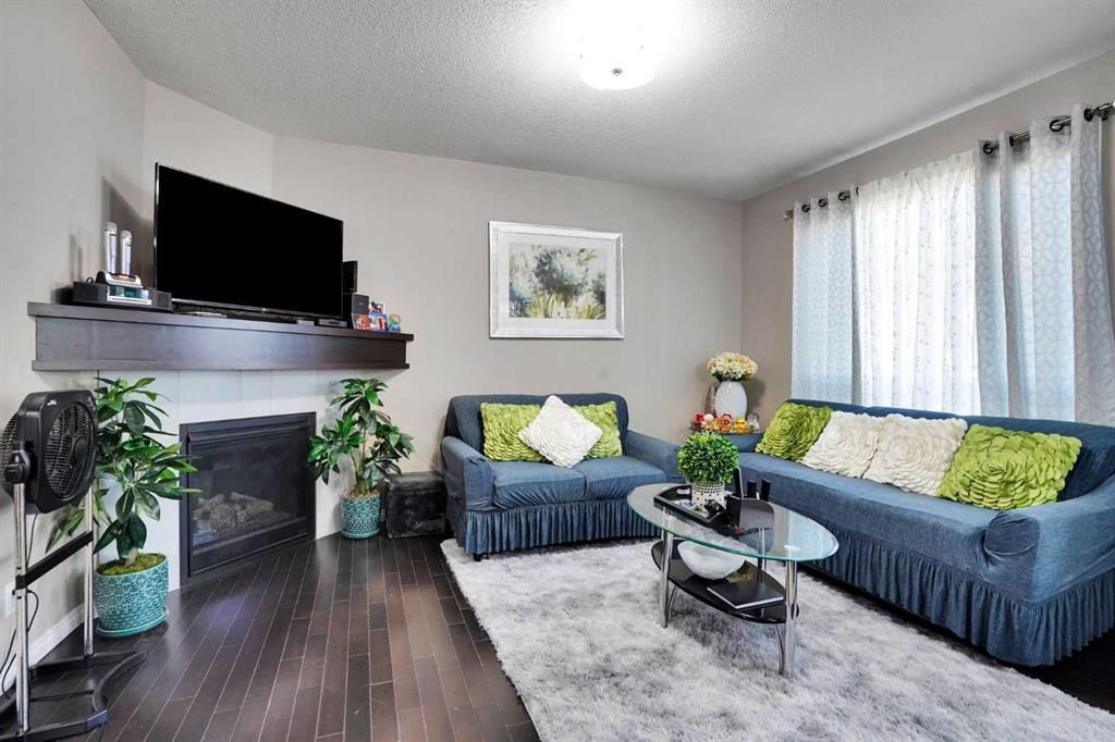 1239 Brightoncrest Green Se, Calgary, AB - Indoor Photo Showing Living Room With Fireplace
