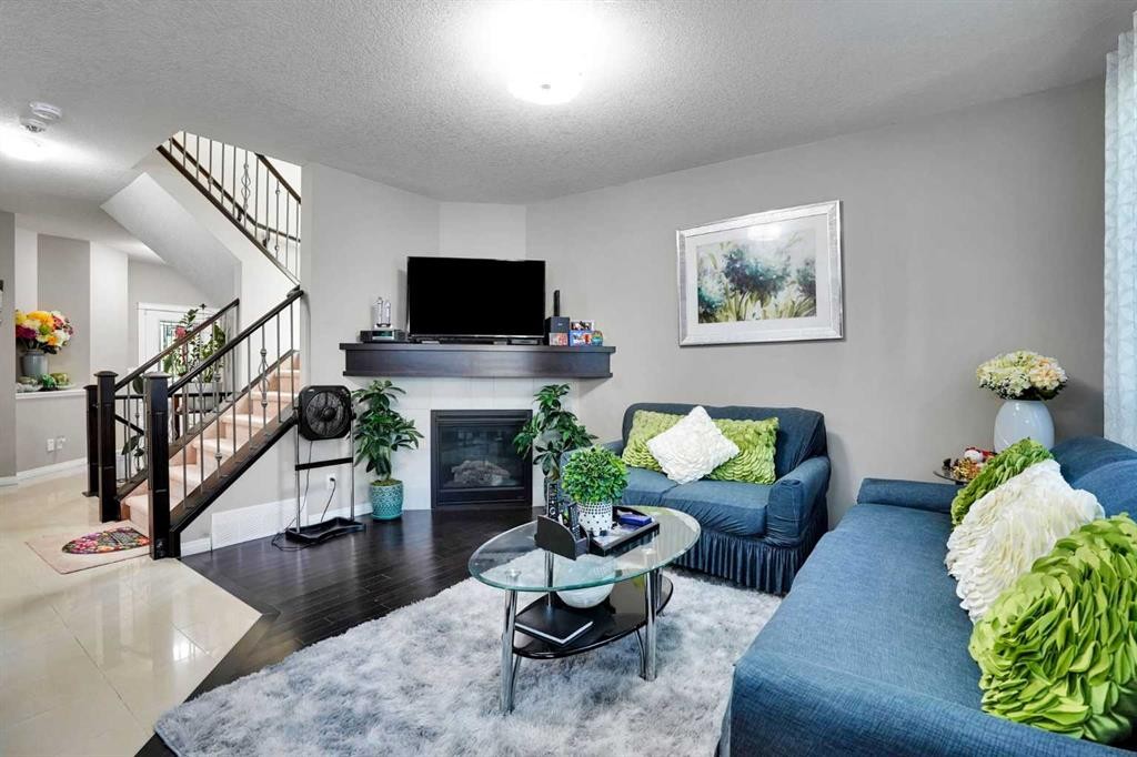1239 Brightoncrest Green Se, Calgary, AB - Indoor Photo Showing Living Room With Fireplace