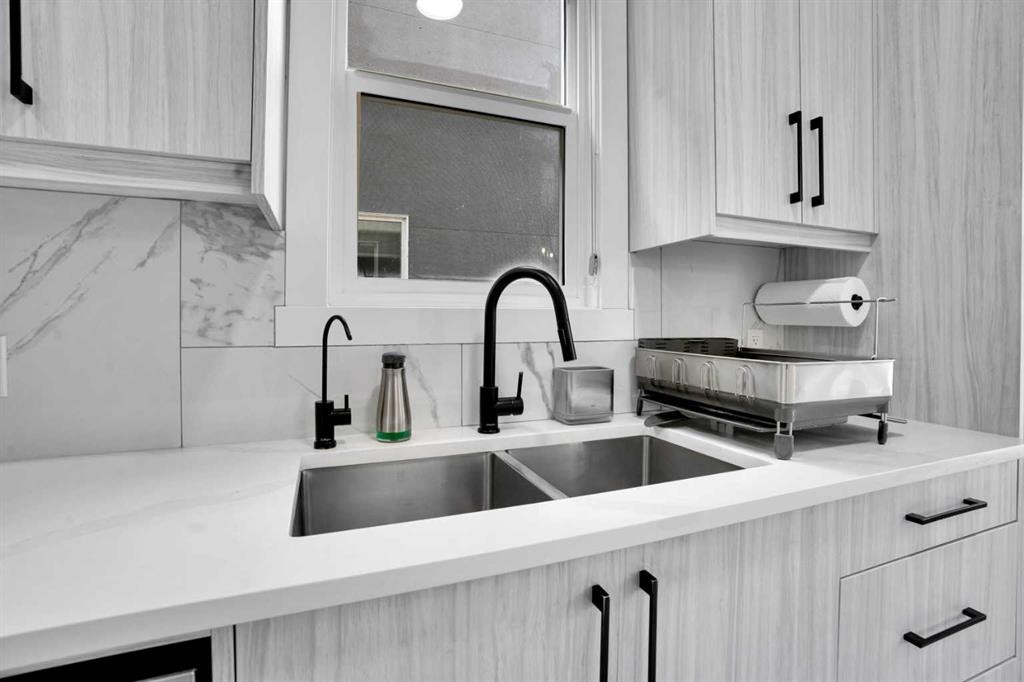 36 Waterford Terrace, Chestermere, AB - Indoor Photo Showing Kitchen With Double Sink
