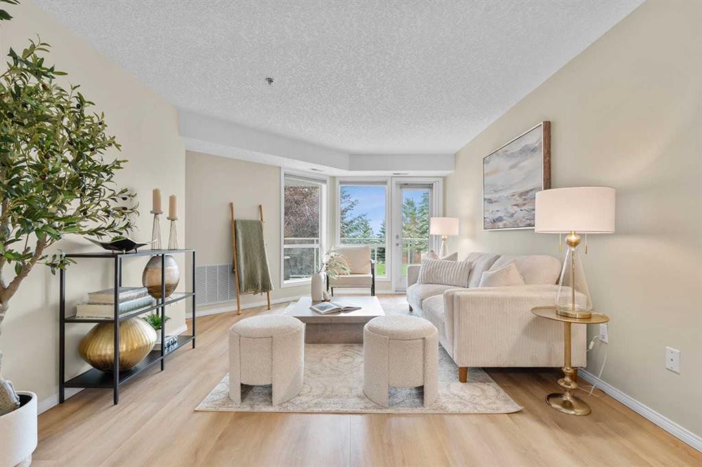1203-1818 Simcoe Boulevard Sw, Calgary, AB - Indoor Photo Showing Living Room