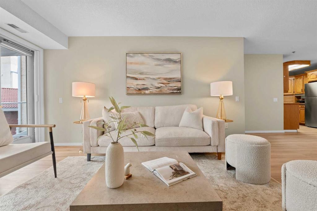 1203-1818 Simcoe Boulevard Sw, Calgary, AB - Indoor Photo Showing Living Room